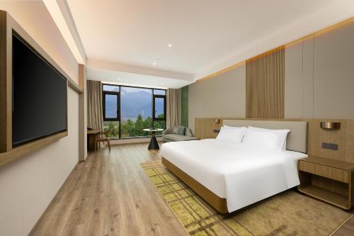 Imagen de la habitación del Hotel Holiday Inn Jiuhua Mountain Hot Spring, an IHG. Foto 14