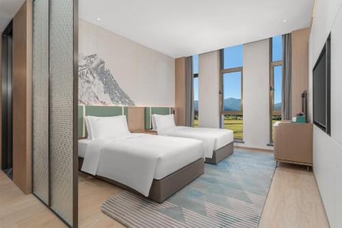 Imagen de la habitación del Hotel Holiday Inn Liaoyuan City Center, an IHG. Foto 17