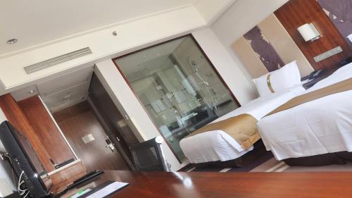 Imagen de la habitación del Hotel Holiday Inn Qingdao City Centre, An Ihg. Foto 3