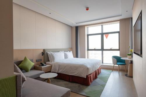 Imagen de la habitación del Hotel Holiday Inn Taiyuan Sunshine, an IHG. Foto 13
