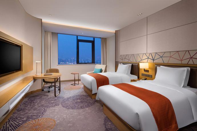 Imagen de la habitación del Hotel Holiday Inn Tianjin Xiqing. Foto 6