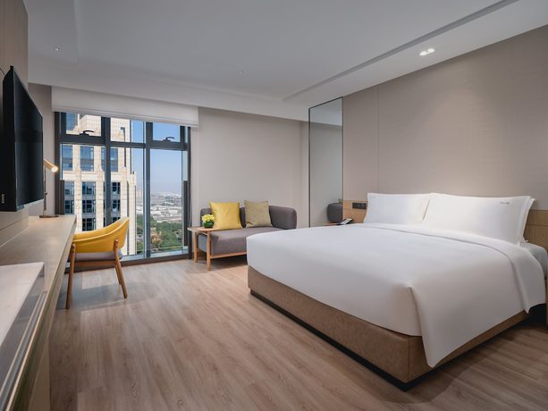 Imagen de la habitación del Hotel Holiday Inn and Suites Kunshan Huaqiao, an IHG. Foto 7