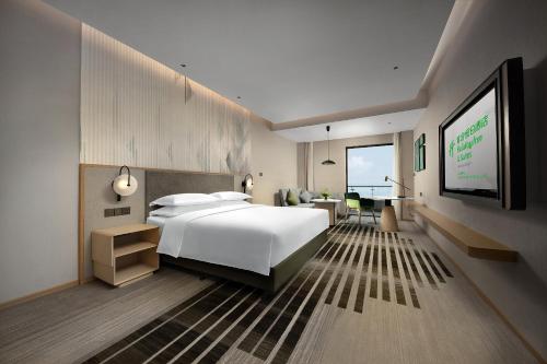 Imagen de la habitación del Hotel Holiday Inn and Suites Wuhan International Expo, an IHG Hotel. Foto 12