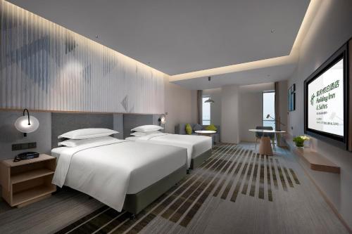 Imagen de la habitación del Hotel Holiday Inn and Suites Wuhan International Expo, an IHG Hotel. Foto 13
