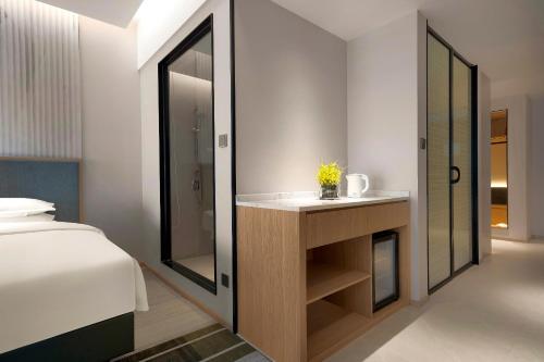 Imagen de la habitación del Hotel Holiday Inn and Suites Wuhan International Expo, an IHG Hotel. Foto 17
