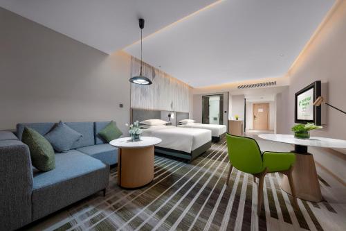 Imagen de la habitación del Hotel Holiday Inn and Suites Wuhan International Expo, an IHG Hotel. Foto 18