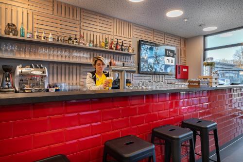 Imagen del bar/restaurante del Hotel Holiday Inn - the niu, Keg Hamburg Ost by IHG. Foto 7