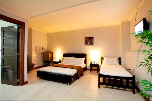 Imagen de la habitación del Hotel Holiday Plaza, Laoag. Foto 6