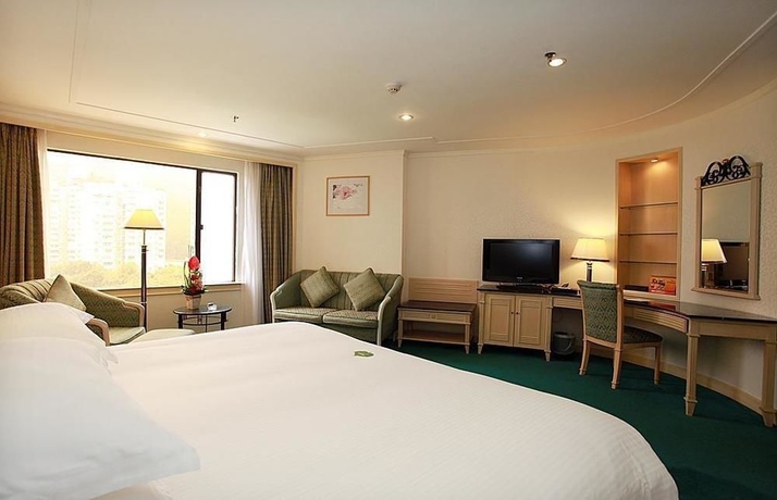 Imagen de la habitación del Hotel Holiday Resort, Zhuhai. Foto 4