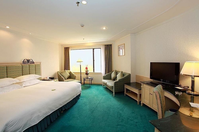 Imagen de la habitación del Hotel Holiday Resort, Zhuhai. Foto 10