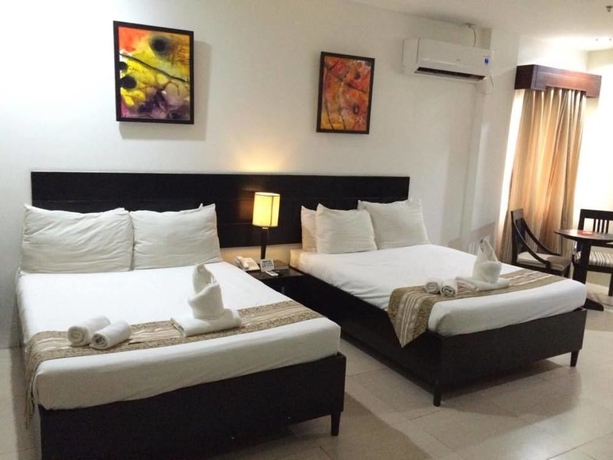 Imagen de la habitación del Hotel Holiday Suites Puerto Princesa. Foto 2