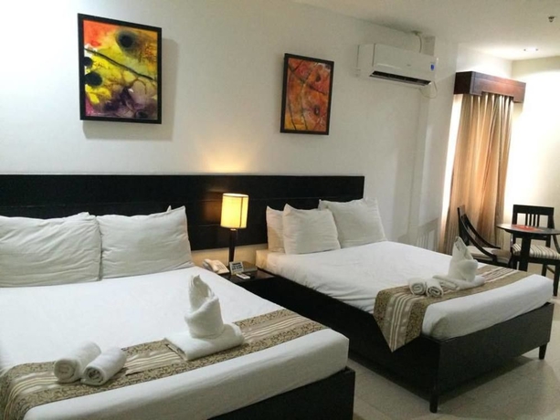 Imagen de la habitación del Hotel Holiday Suites Puerto Princesa. Foto 6