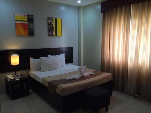 Imagen de la habitación del Hotel Holiday Suites Puerto Princesa. Foto 7