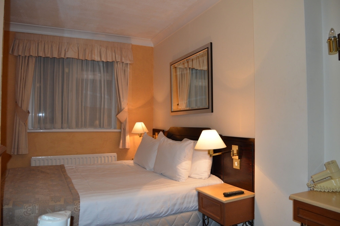 Imagen de la habitación del Hotel Holiday Villa. Foto 5