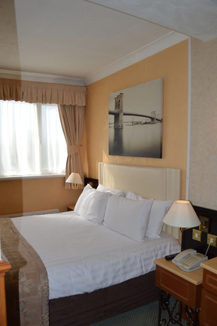 Imagen de la habitación del Hotel Holiday Villa. Foto 8