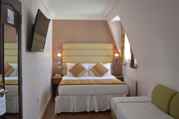 Imagen de la habitación del Hotel Holiday Villa. Foto 11