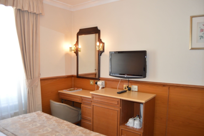 Imagen de la habitación del Hotel Holiday Villa. Foto 14