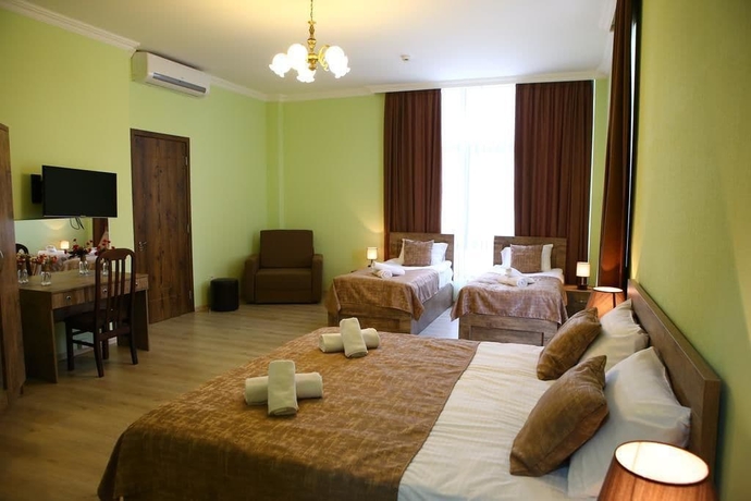 Imagen de la habitación del Hotel Holiday Villa, Tbilisi. Foto 12