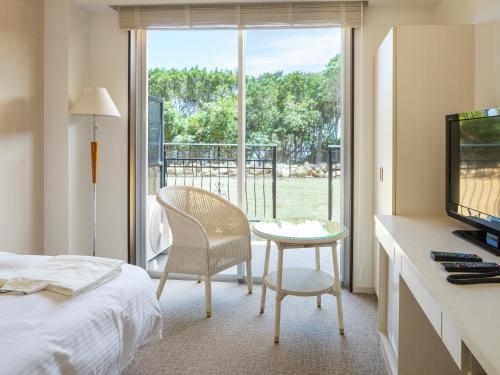 Imagen de la habitación del Hotel Holistic Resort. Foto 6