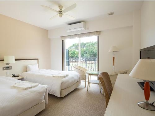 Imagen de la habitación del Hotel Holistic Resort. Foto 7