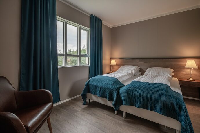 Imagen de la habitación del Hotel Holt Inn. Foto 16