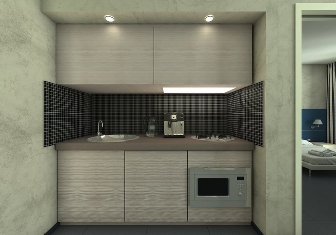 Imagen de la habitación del Hotel Home Club Suite. Foto 12