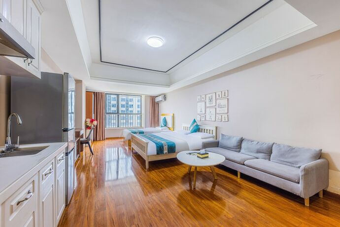 Imagen de la habitación del Hotel Home Inn Huayi Apartment. Foto 12