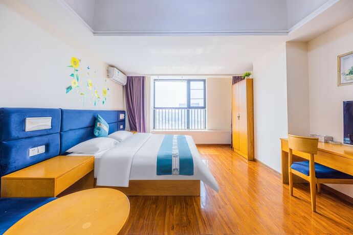 Imagen de la habitación del Hotel Home Inn Huayi Apartment. Foto 14