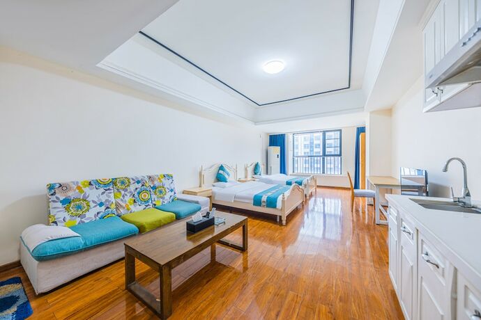 Imagen de la habitación del Hotel Home Inn Huayi Apartment. Foto 15