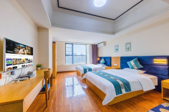 Imagen de la habitación del Hotel Home Inn Huayi Apartment. Foto 16