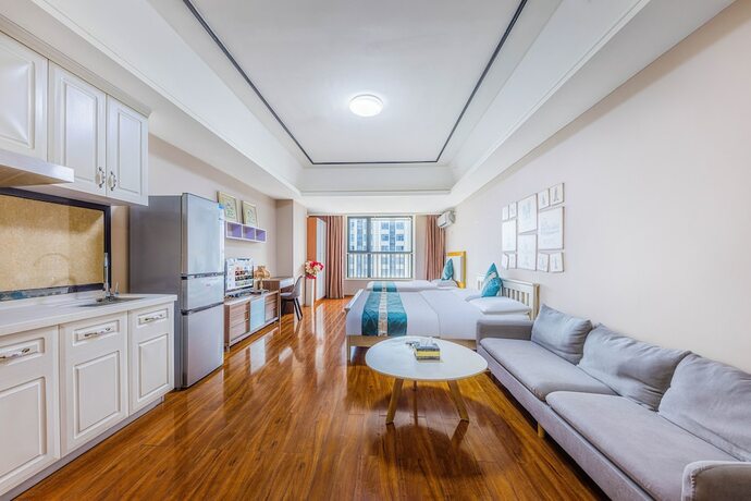 Imagen de la habitación del Hotel Home Inn Huayi Apartment. Foto 17