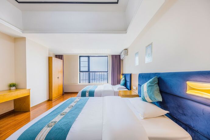 Imagen de la habitación del Hotel Home Inn Huayi Apartment. Foto 19