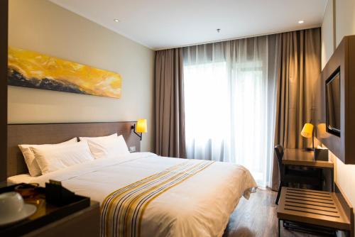 Imagen de la habitación del Hotel Home Inn Plus (Shanghai Xintiandi Lujiabang Road Metro Station). Foto 6