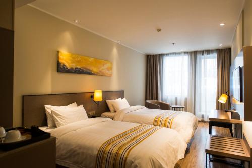 Imagen de la habitación del Hotel Home Inn Plus Shanghai Yushan Road Yuanshen Sports. Foto 9