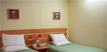 Imagen de la habitación del Hotel Home Inn Xinkai Road - Dalian. Foto 7