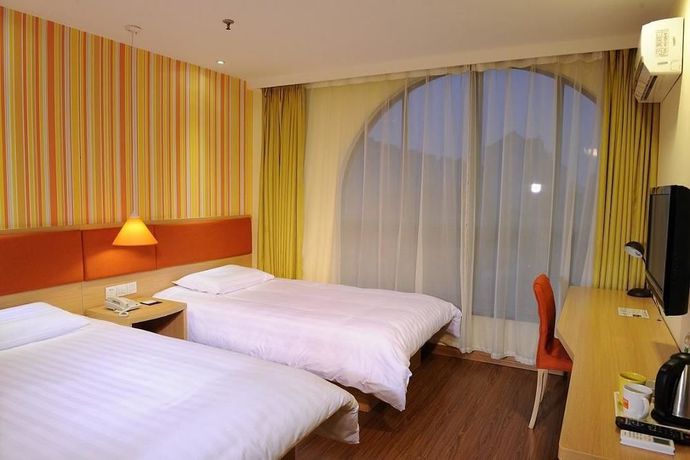 Imagen de la habitación del Hotel Home Inn Yantai Yingchun Avenue. Foto 11