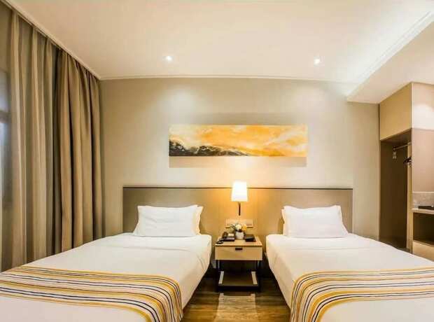 Imagen de la habitación del Hotel Home Inns Collection. Foto 20