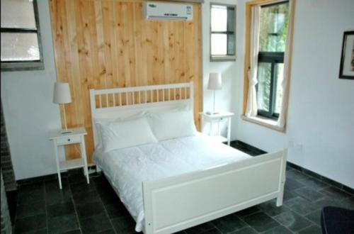 Imagen de la habitación del Hotel Home Of The Great Wall. Foto 10