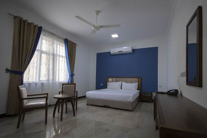 Imagen de la habitación del Hotel Home Station. Foto 4