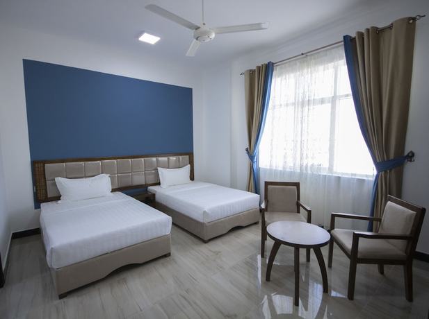 Imagen de la habitación del Hotel Home Station. Foto 6