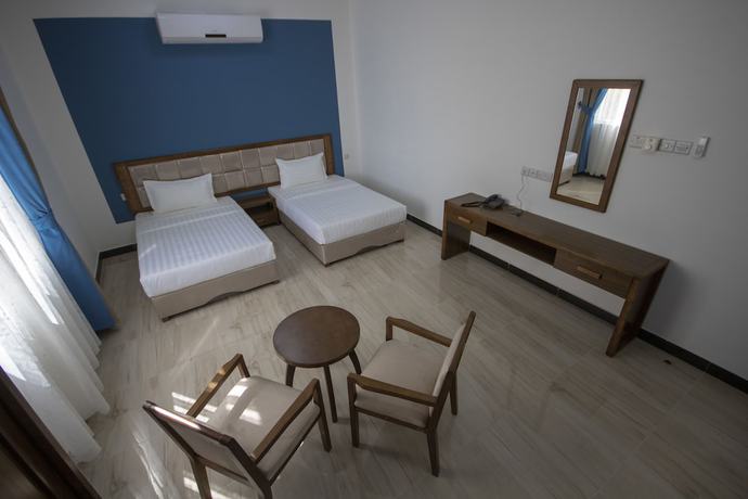 Imagen de la habitación del Hotel Home Station. Foto 8