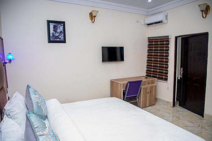 Imagen de la habitación del Hotel Home Suites and Resort. Foto 5