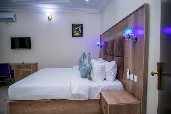 Imagen de la habitación del Hotel Home Suites and Resort. Foto 6