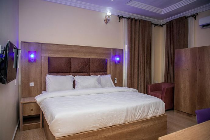 Imagen de la habitación del Hotel Home Suites and Resort. Foto 8