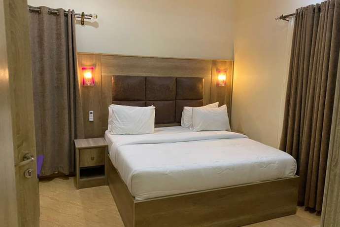 Imagen de la habitación del Hotel Home Suites and Resort. Foto 14