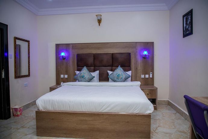 Imagen de la habitación del Hotel Home Suites and Resort. Foto 16