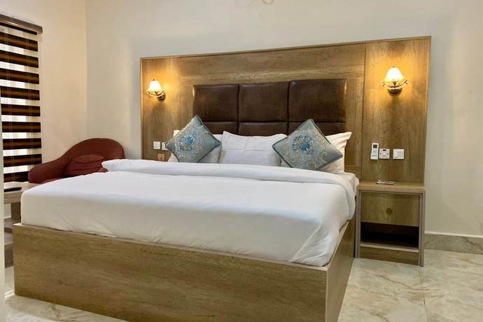 Imagen de la habitación del Hotel Home Suites and Resort. Foto 18