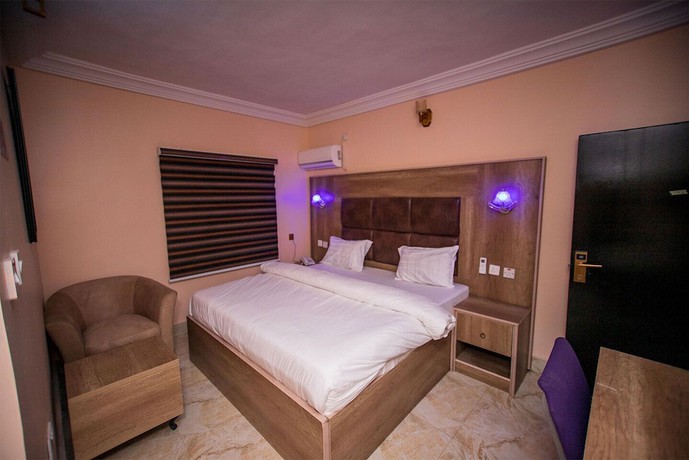 Imagen de la habitación del Hotel Home Suites and Resort. Foto 19