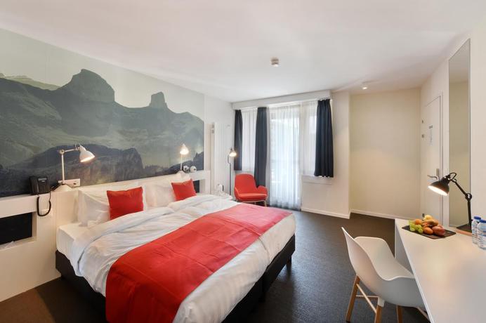 Imagen de la habitación del Hotel Home Swiss. Foto 9