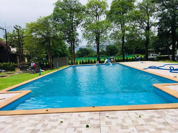 Imagen de la piscina del Hotel Home and Hill Resort. Foto 19